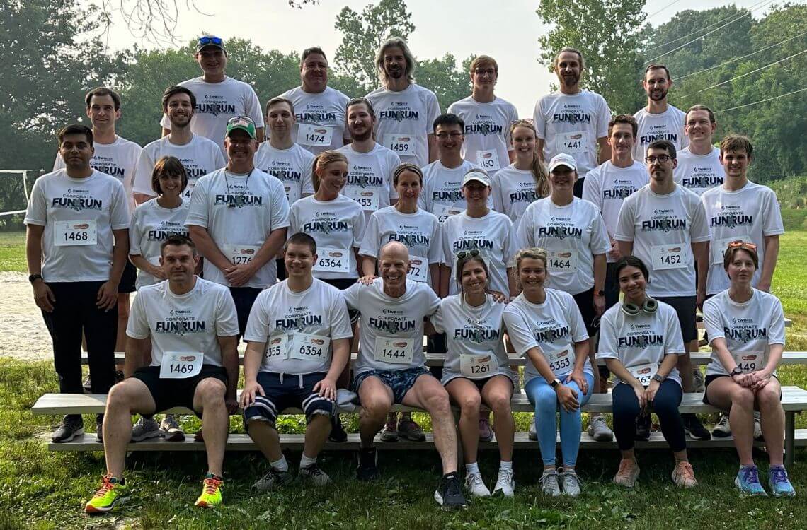 TST employees taking a photo at a corporate run