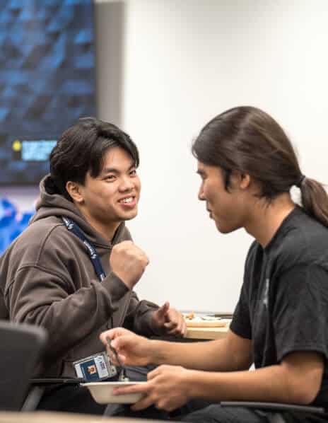 TwoSix Technology interns smiling and talking together