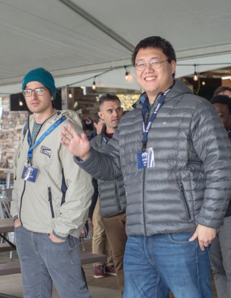 Two TST employees smiling for a picture at a company event
