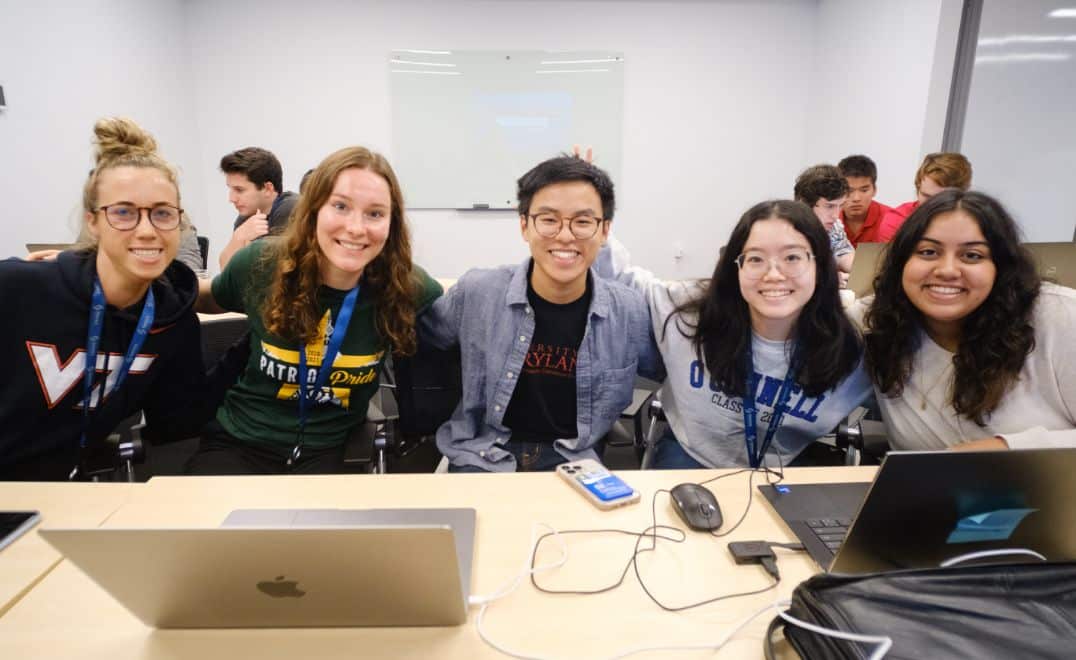 TST interns smiling for a group photo