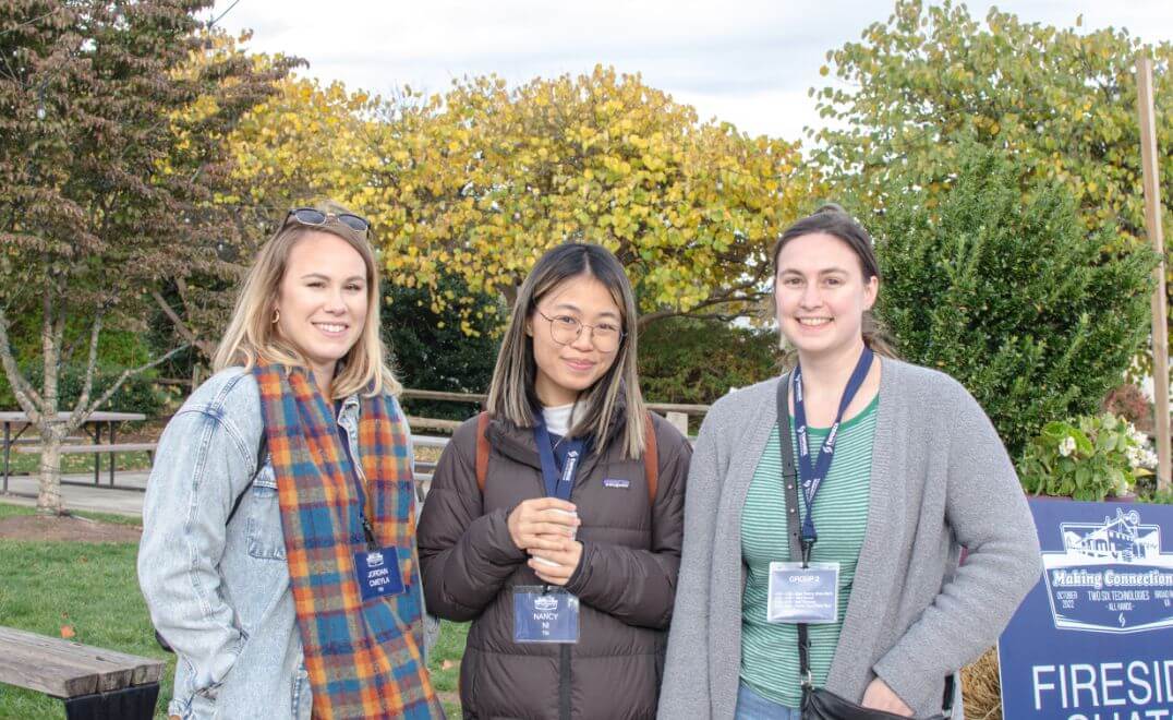 TST employees taking a photo during the fall