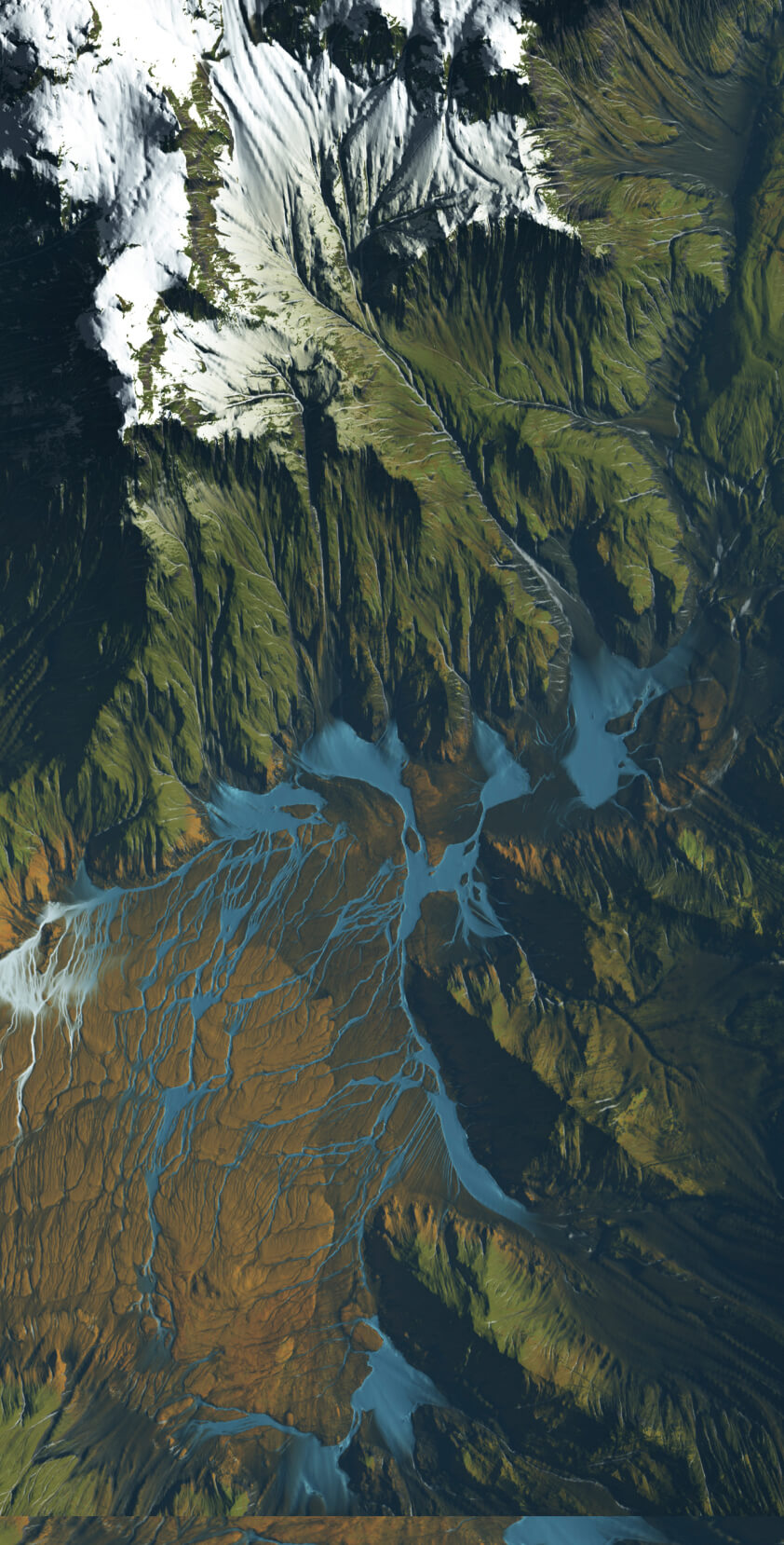 Aerial view of snow-capped mountains, green valleys, and winding blue rivers flowing through rugged terrain.