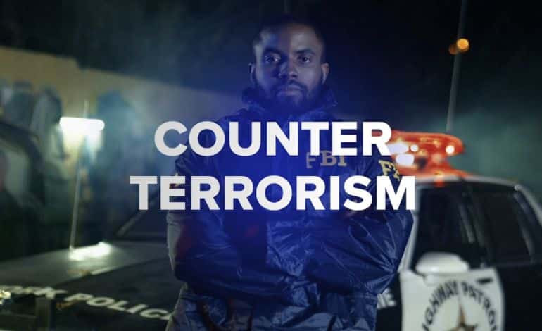 Text that says Counter Terrorism with a man who works for the FBI behind it